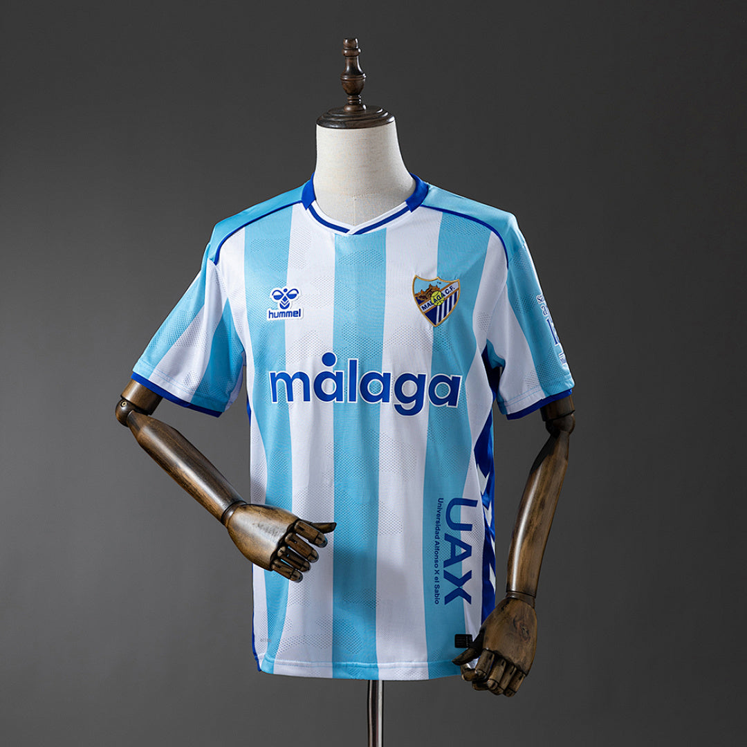 Camisa Malaga Home 4xl9 25/26